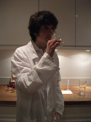 Jake tasting his blend in a lab coat