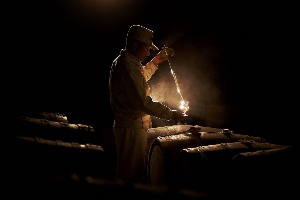 Tasting barrels of whisky at Yamazaki in Japan