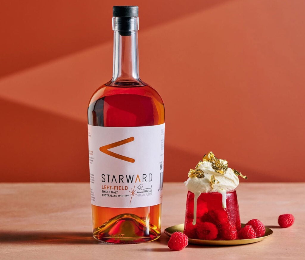 A bottle of Starward Left-Field with a dessert