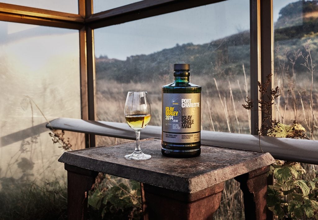 A glass and bottle of Port Charlotte Islay Barley 2014