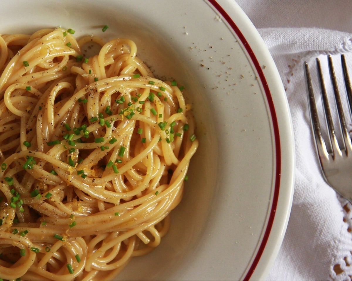 A bowl of pasta and with whisky egg yolk sauce