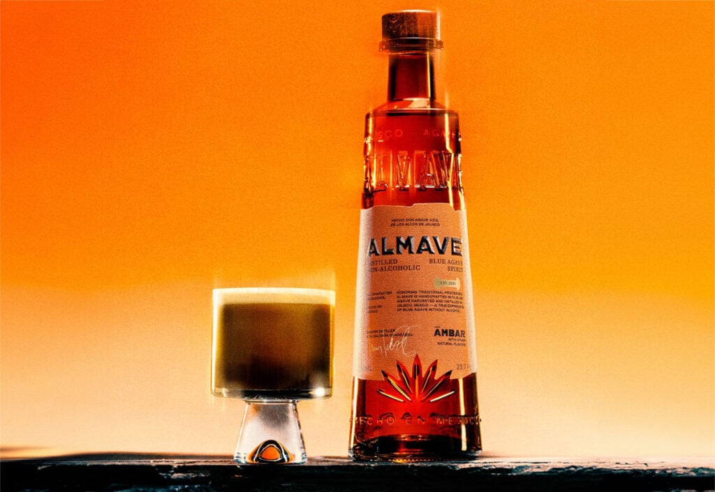 The Ámbar Carajillo mocktail with a bottle of Almave Ambar Non-Alcoholic Blue Agave Spirit