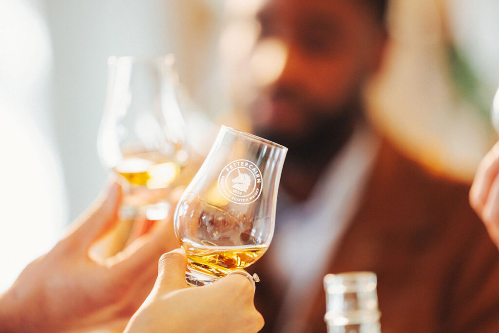 People toasting whisky as Fettercairn Distillery celebrates its 200th anniversary in 2024