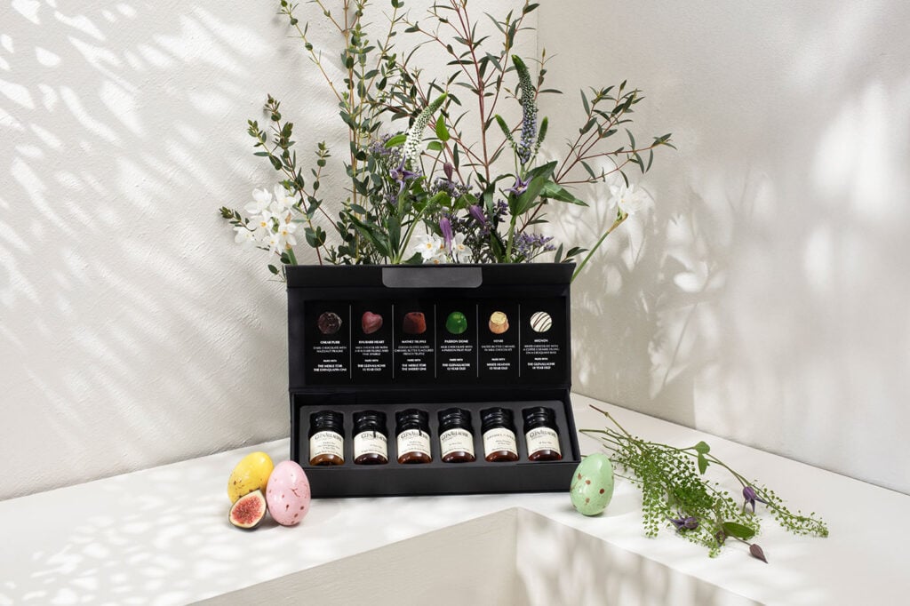 The GlenAllachie Whisky & Chocolate Easter Tasting Set in an Easter-themed photoshoot