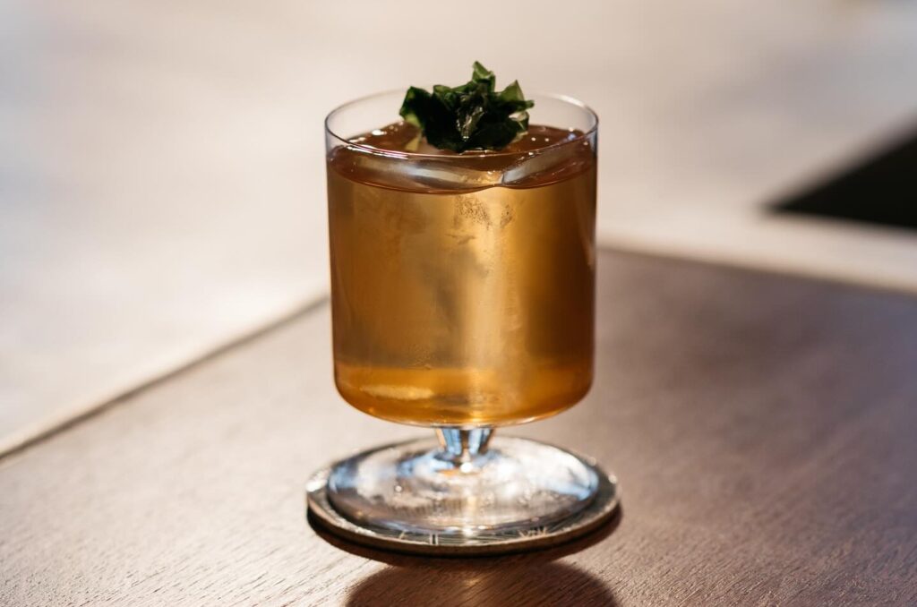 The Wallet cocktail at Kwãnt Mayfair, pictured on a bar