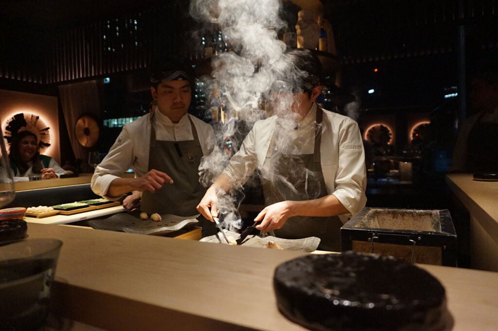 Chefs prepare fish at Omakase Restaurant for International Whisky Day