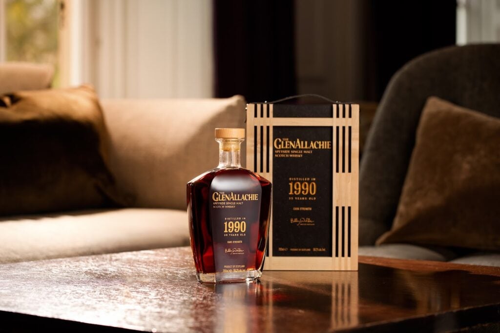 The bottle and presentation of The GlenAllachie 35 Year Old Cask Strength on a wooden table