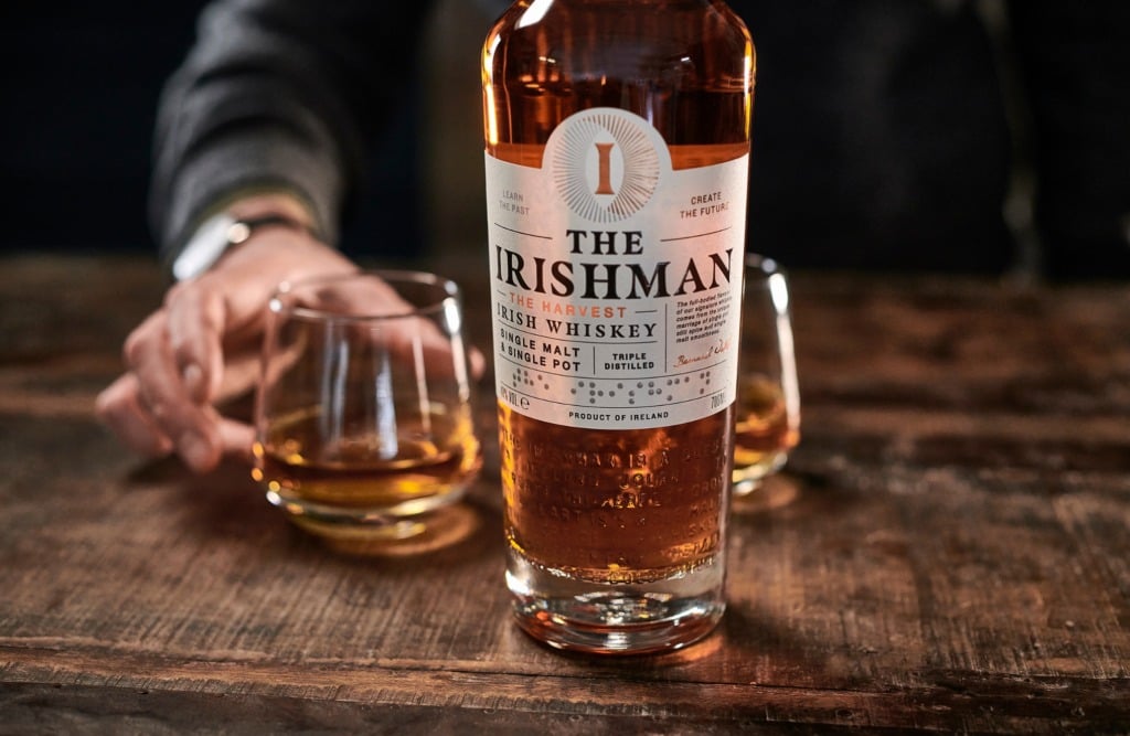 A bottle and glass of The Irishman whiskey