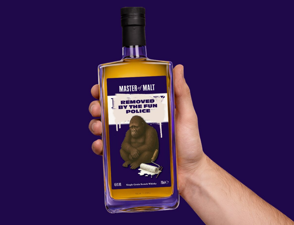 A bottle of Dalry M*** in a person's hand
