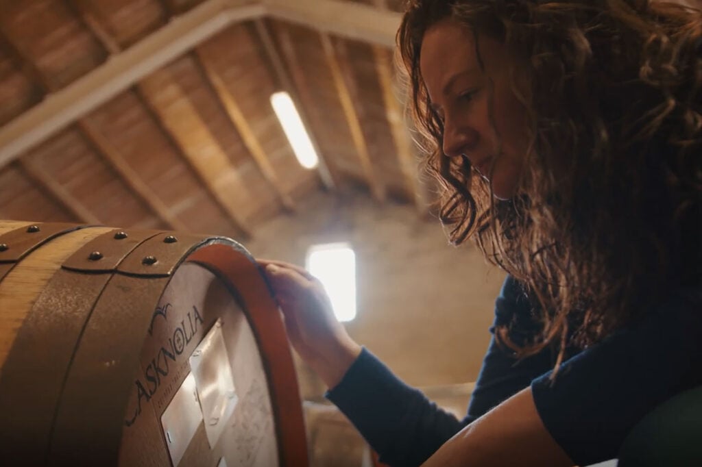 A cask of Tormore whisky with distillery manager Polly Logan