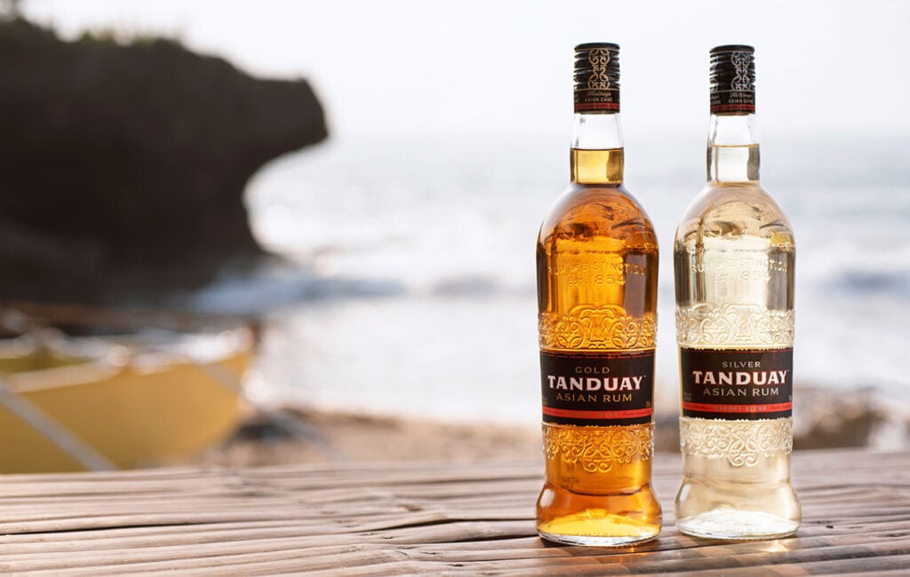 Bottles on rum on the beach