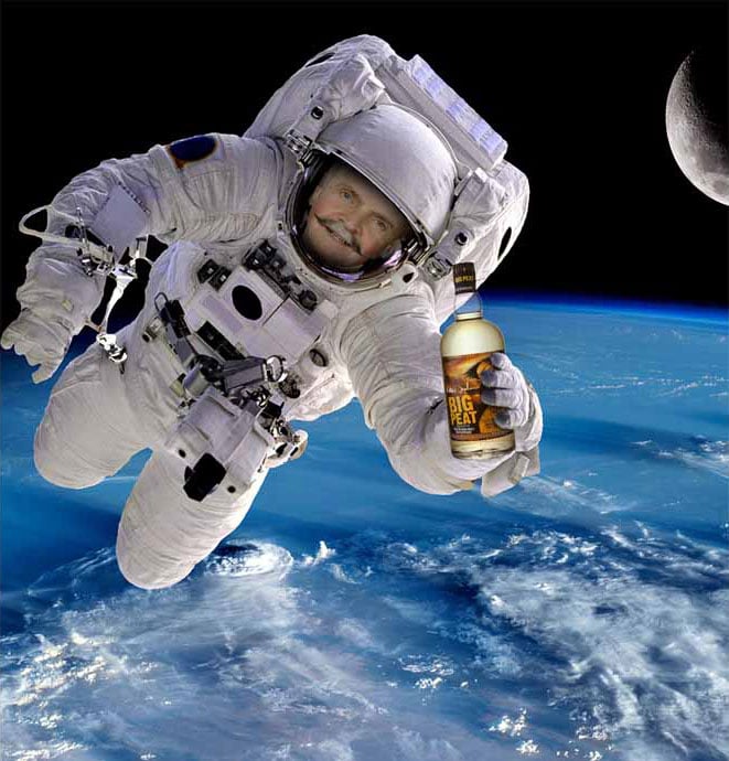 a mock up of Fred Laing in a spacesuit floating in space above the earth