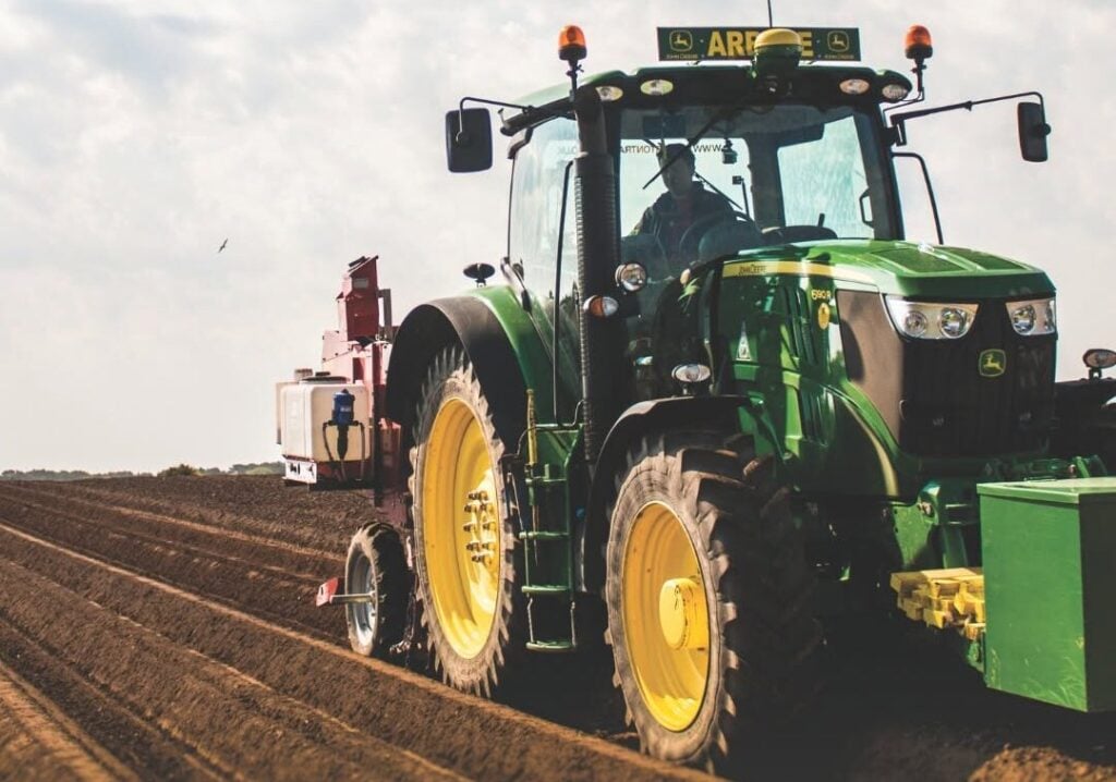 A tractor in a field at Arbikie Distillery
