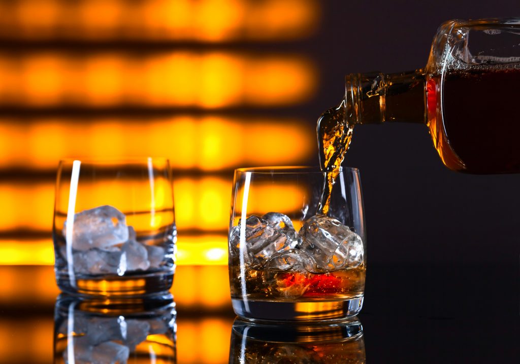 Glass of whiskey with ice