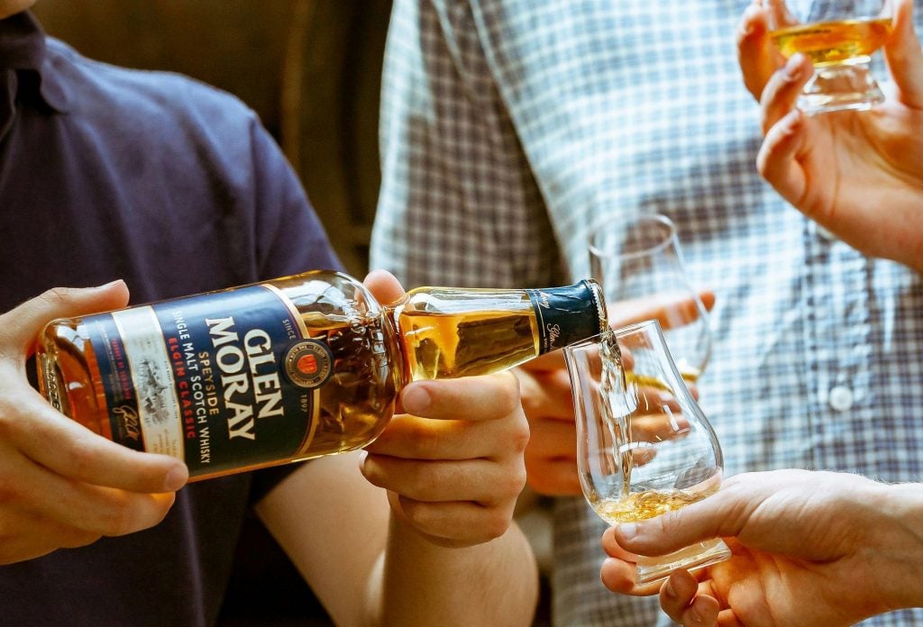 Glen Moray single malt being poured into a Glencairn glass. It's an example here of premium whisky that doesn't have a premium price tag