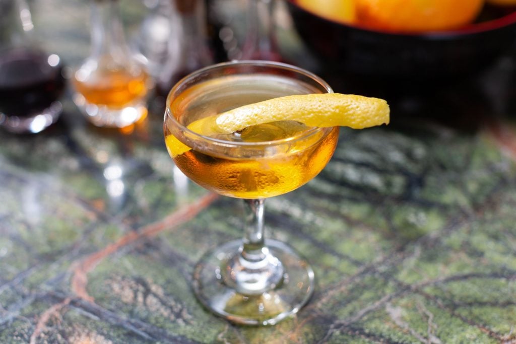 Manhattan cocktail with orange peel, easy cocktails to make at home
