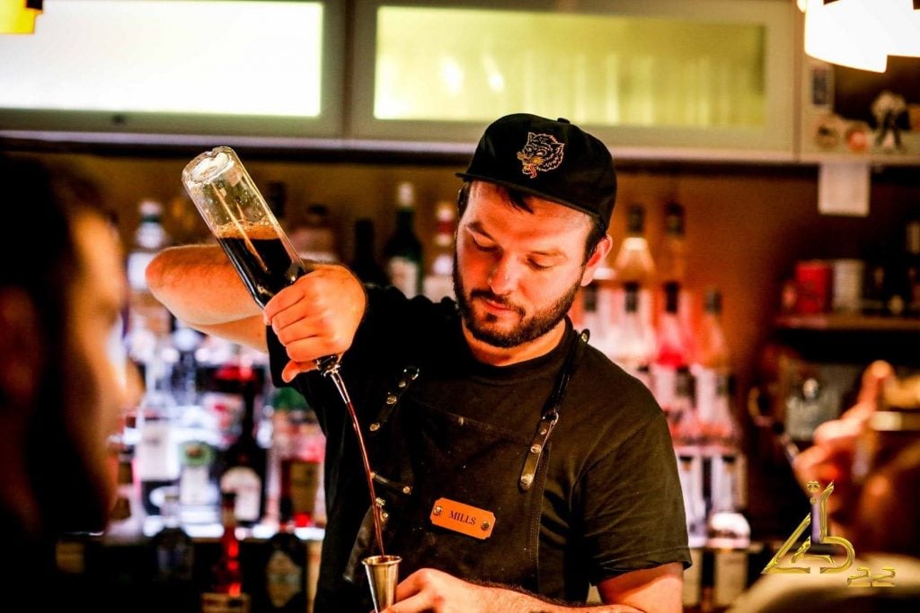 Alex Mills from Lab 22 in Cardiff pouring vodka