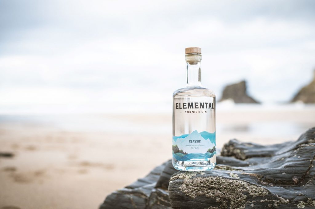 Elemental Cornish Gin on a beach