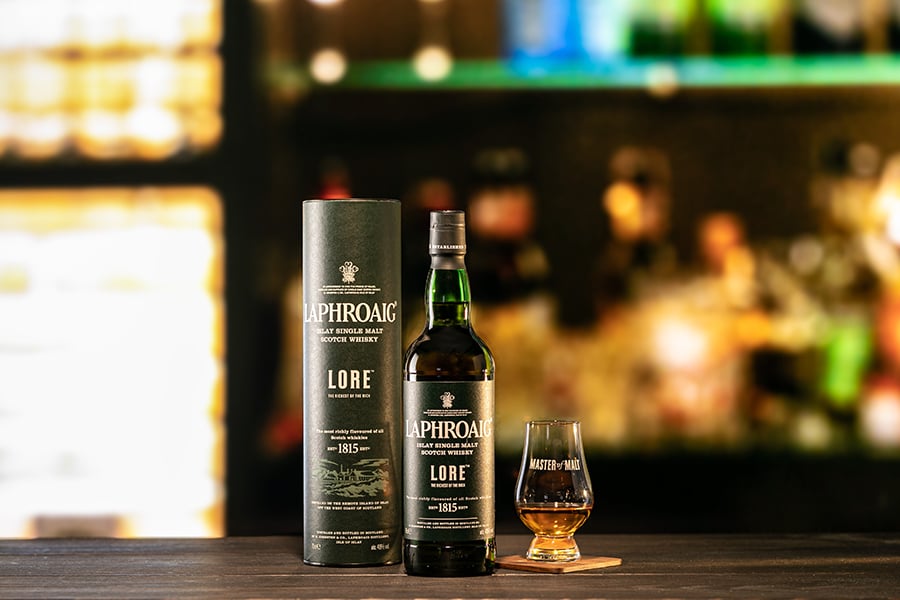 A bottle and glass of Laphroaig Lore