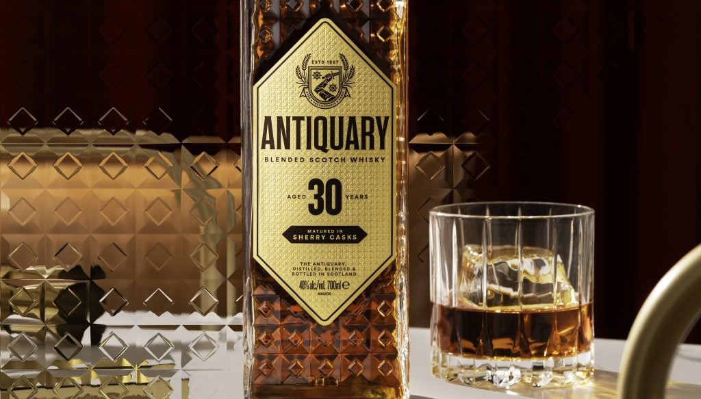 Antiquary 30 year old bottle and glass