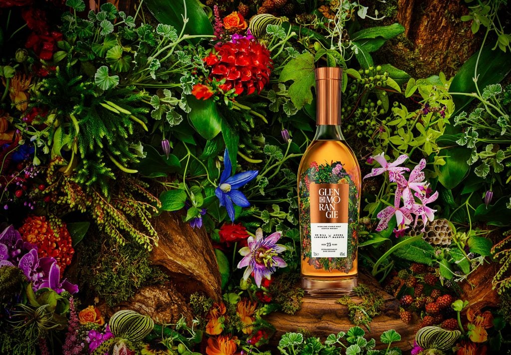 A bottle of Glenmorangie Dr Bill Lumsden x Azuma Makoto 23 Years Old alongside a botanical sculpture