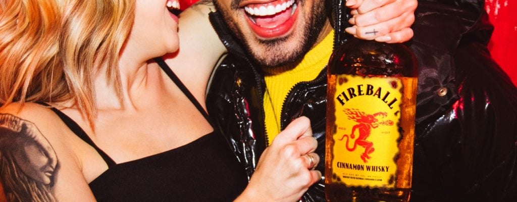 People enjoying a bottle of Fireball Cinnamon Whisky Liqueur