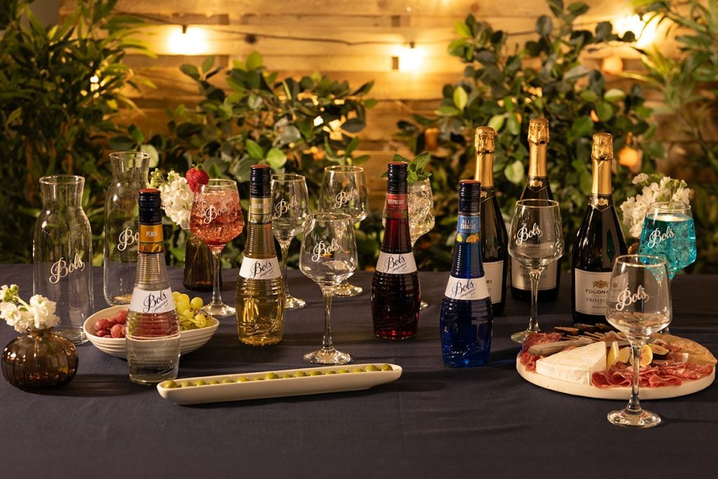 A range of Bols products with food and mixers