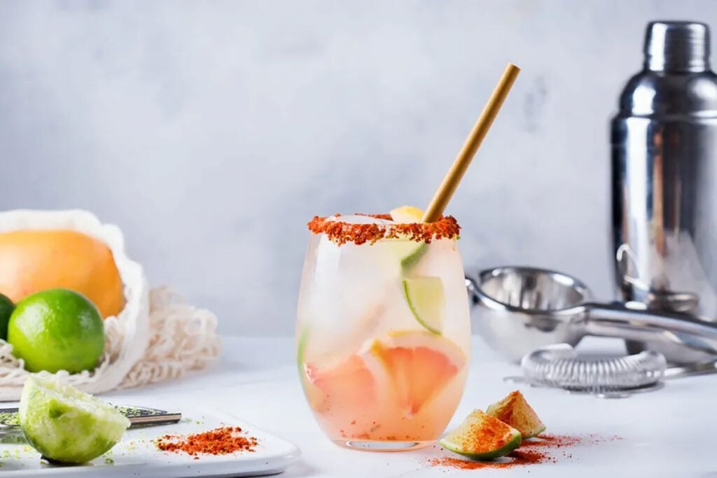 A glass of Del Maguey's Smoky Paloma. with cocktail ingredients
