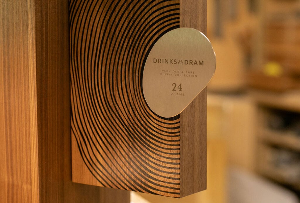 The Drinks by the Dram logo on the Very Old & Rare Whisky cabinet