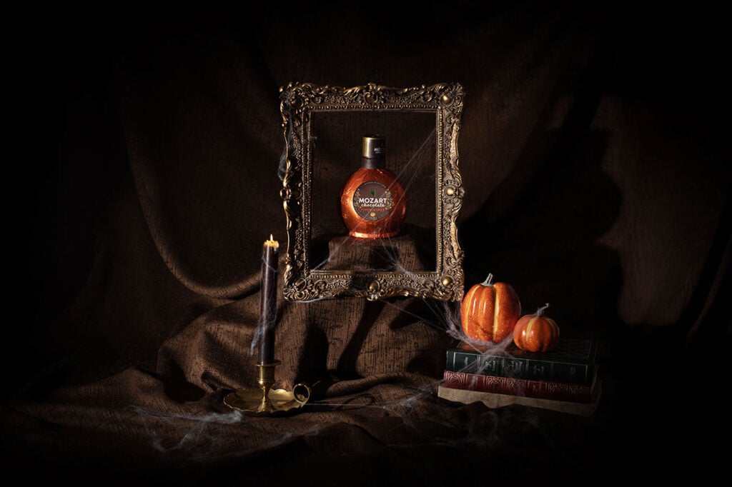 Mozart Pumpkin Spice Chocolate Cream Liqueur from Master of Malt in a Halloween scene