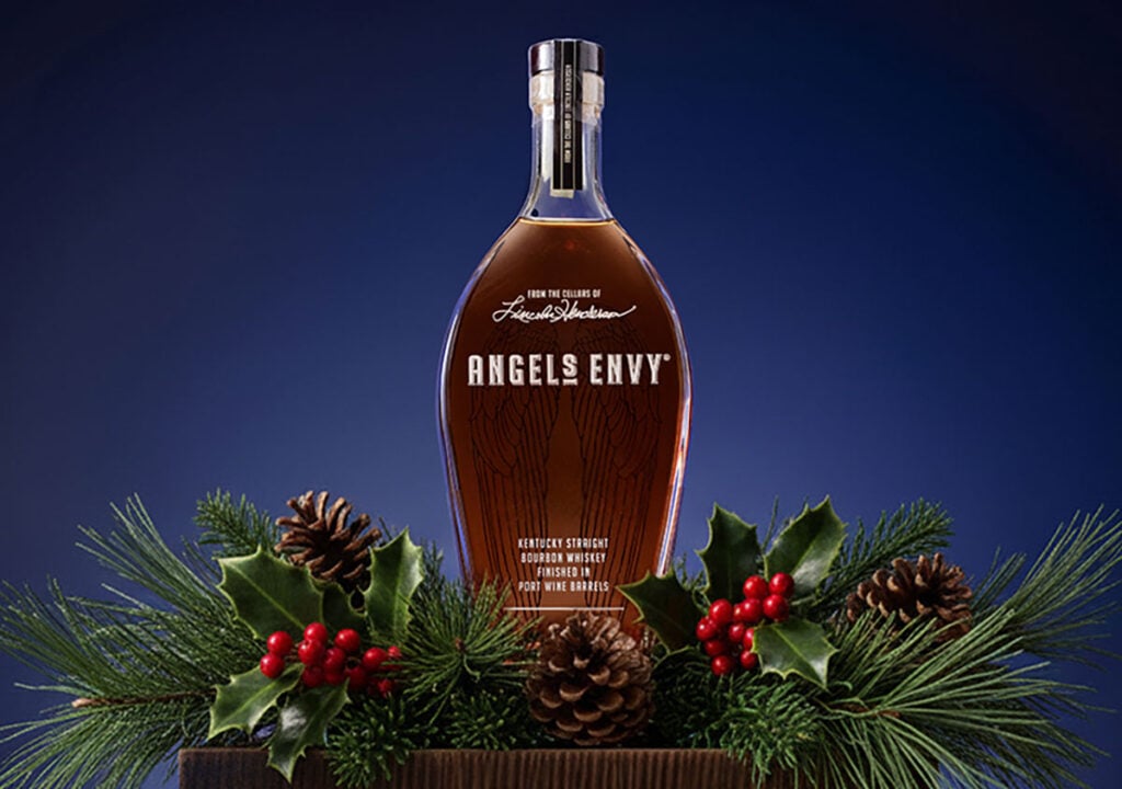 Angel's Envy bourbon in a Christmas scene. It features in our Beginner Christmas Whisky Gift Guide