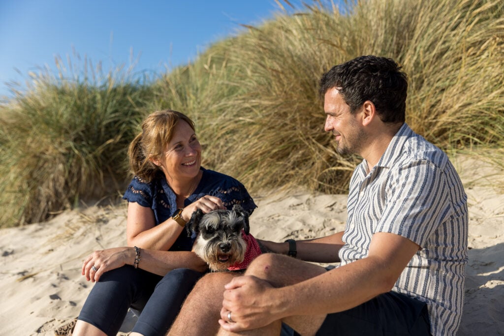 Stannergill Distillery founders Martin and Claire Murray on the beach with their dog