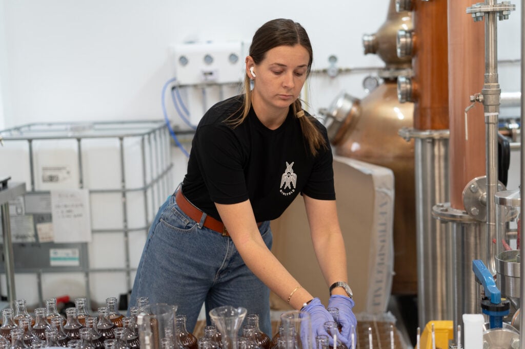A distillery worker at the Ninefold rum distillery in Scotland