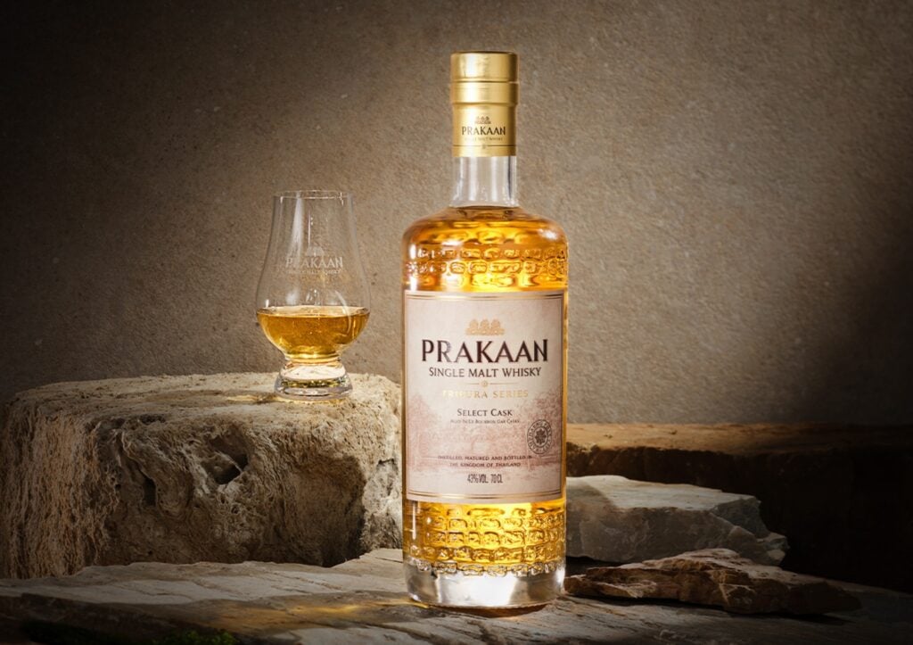 A bottle and glass of Prakaan Select Cask Thai Single Malt Whisky