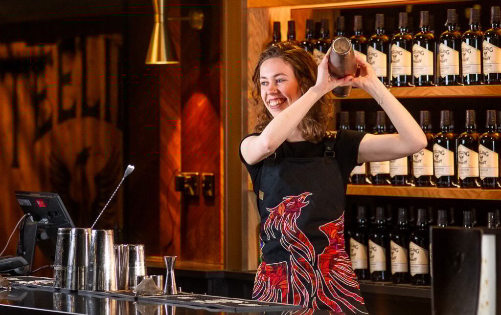 A bartender shakes drinks at the bar at Teeling Distillery, Dublin