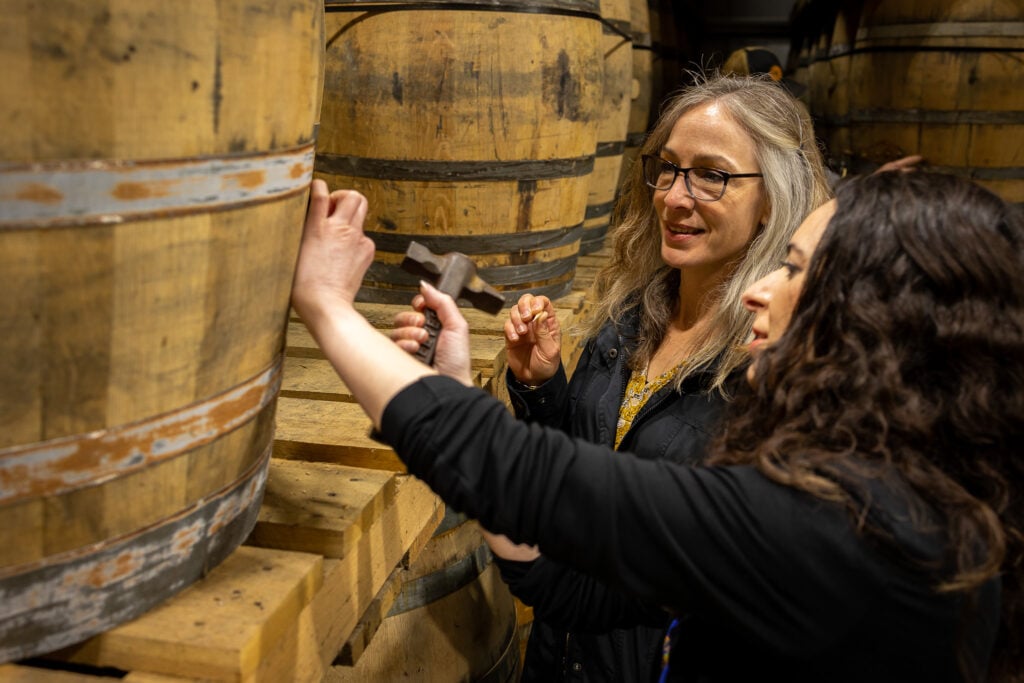 Women in the warehouse of the Virginia Distillery Co.
