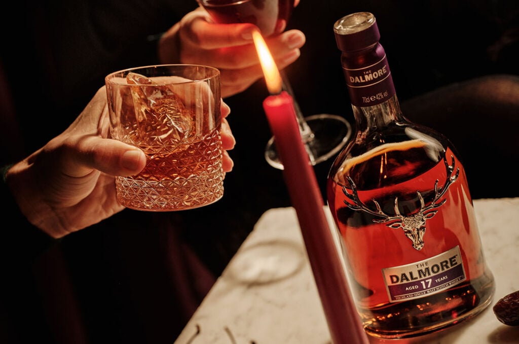 The Dalmore 17 Year Old being drunk by two people over a candlelight