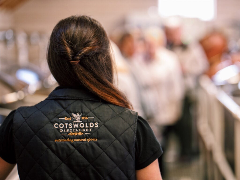 The Cotswolds fermentation tanks with distillery workers