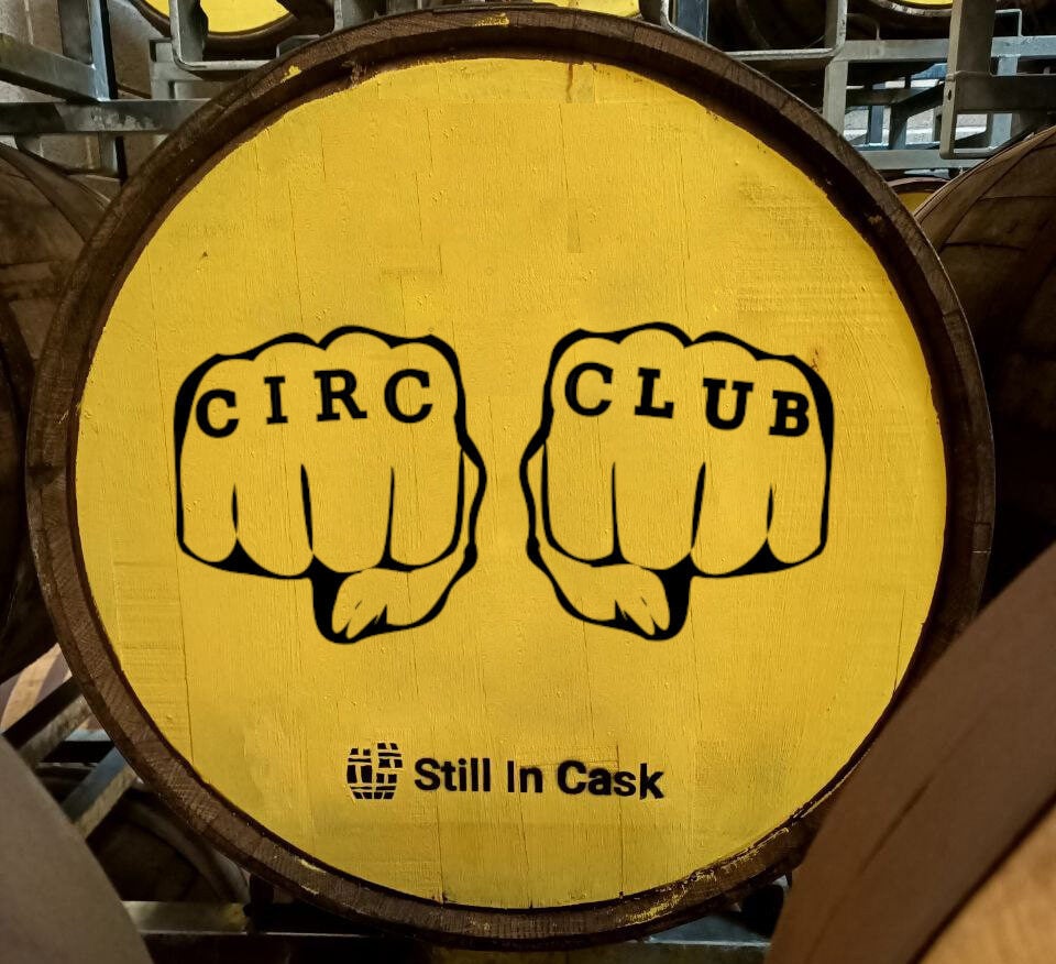 A barrel marked with Circumstance Distillery's Circ Club logo