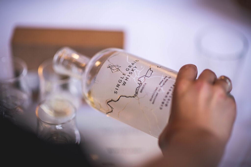 Circumstance whisky being poured into a Glencairn glass